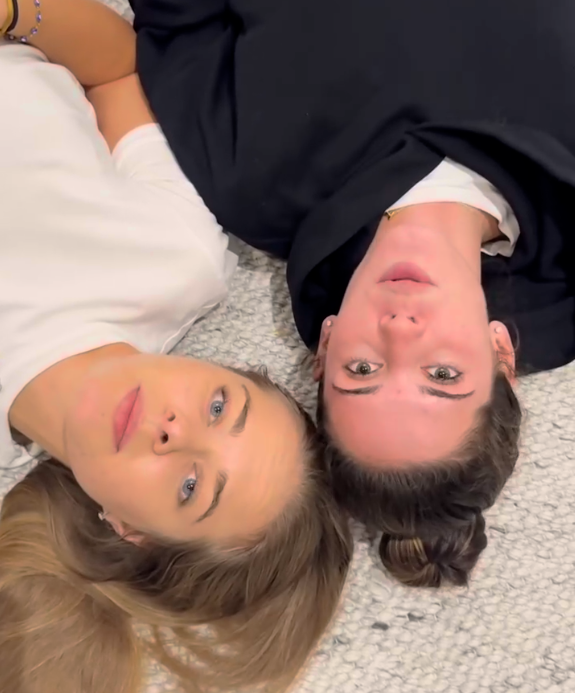 Two women lying on the floor in a relaxed setting, enjoying wellness and balance, representing the Seed Cycle healthy lifestyle for hormonal support