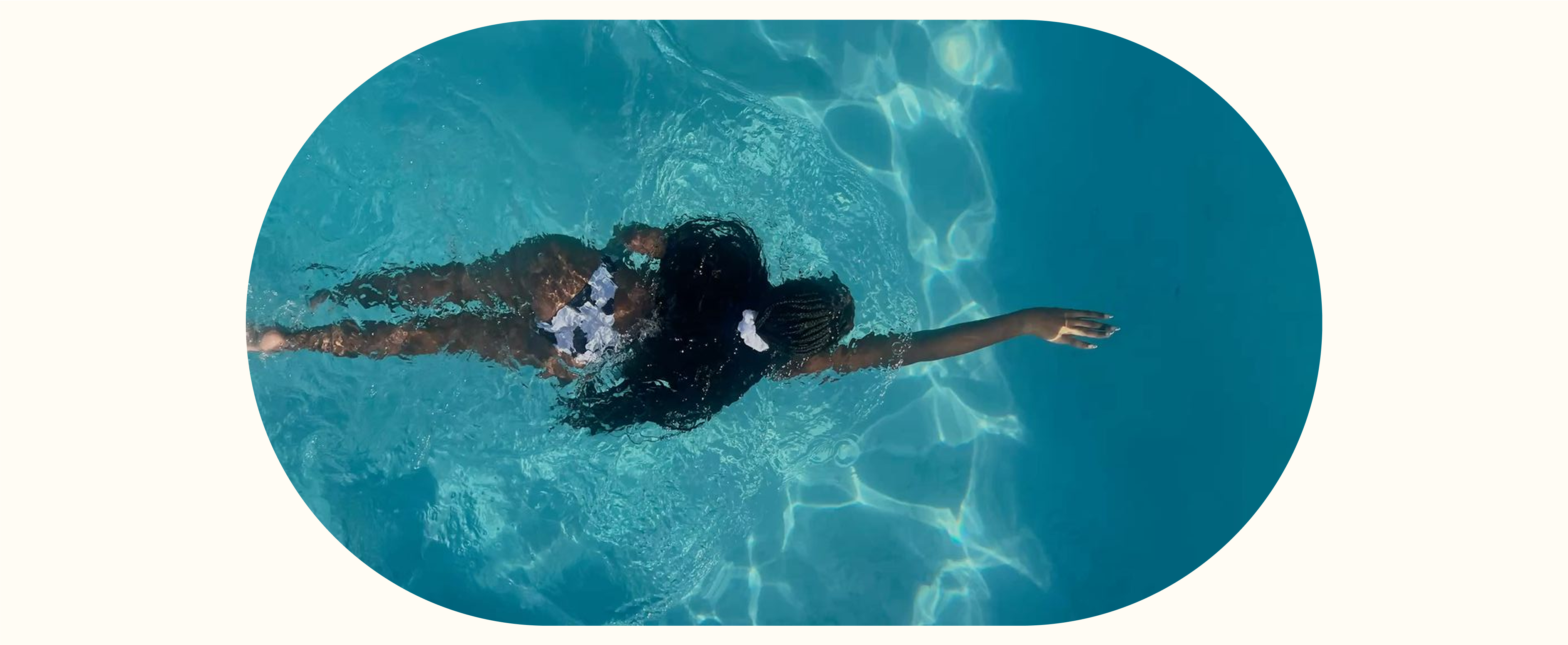 Woman swimming freely in the water, symbolizing balance, freedom, and natural wellness achieved through Seed Cycle Kit for hormone health
