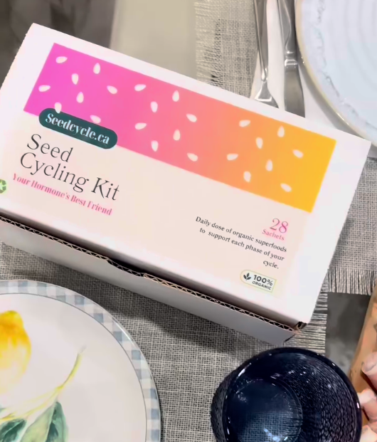 Seed Cycle organic seed cycling kit box displayed, highlighting eco-friendly, convenient packaging for hormonal balance and menstrual health