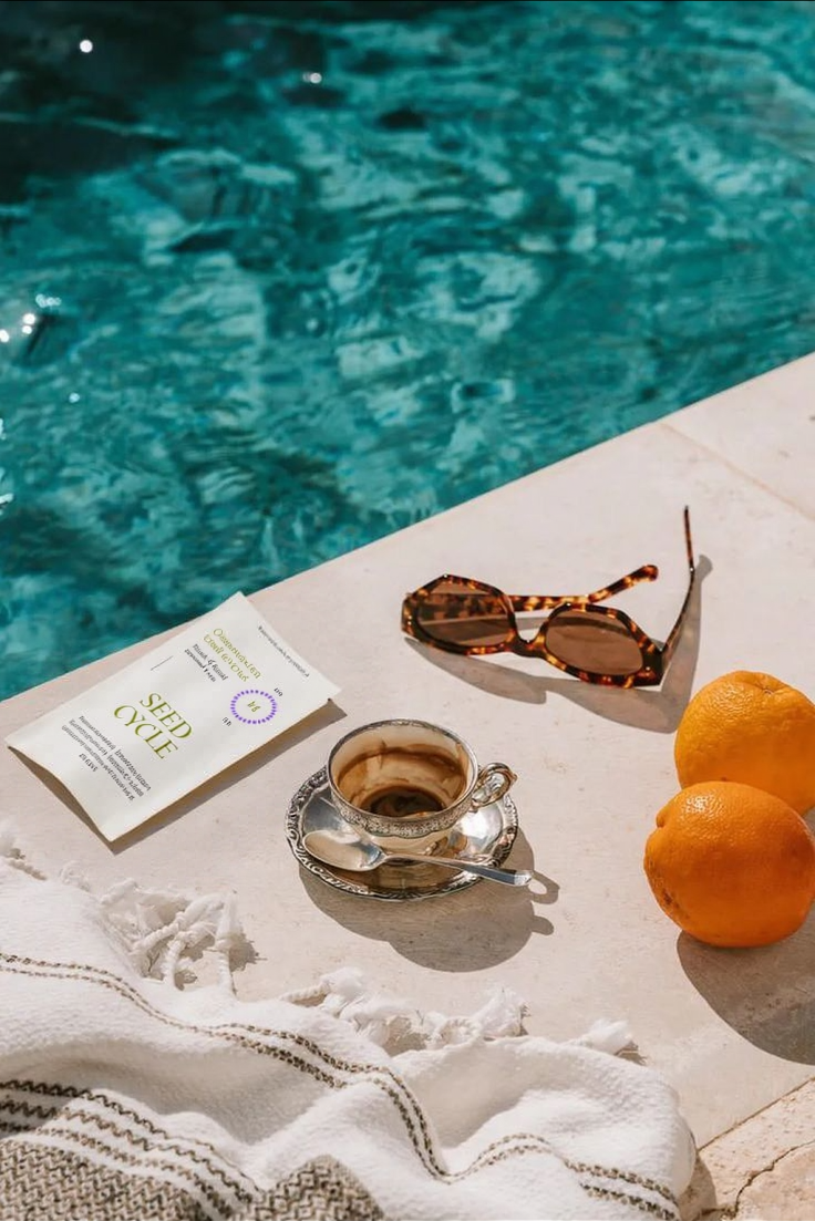 Seed Cycle Kit placed on a poolside deck – lifestyle product photo symbolizing balance, freedom, and natural wellness through organic seed cycling for hormone health